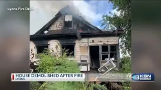 Crews fighting fire at Kansas house end up tearing it down