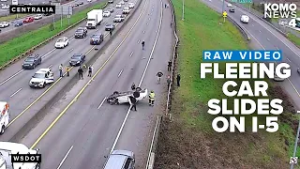 RAW: Fleeing car slides on roof on I-5 in Centralia