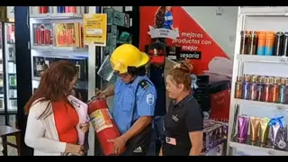 Firefighters inspect electrical systems at Carlos Roberto Huembes market