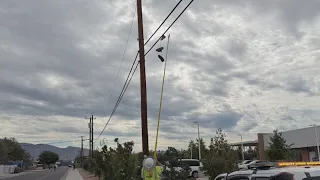PNM & City of Albuquerque take over 100 pairs of shoes down from power lines