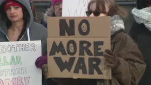Suburban protesters rally against joint US and Israeli military strikes on Iran