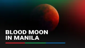 Dozens gather to watch rare 'blood moon' in Manila