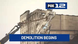Crews begin removing walls of Centennial Mills building