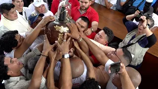 Santo Domingo de Guzmán is lowered and dressed for his visit to Managua