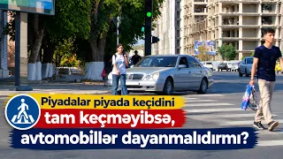 Piyadalar piyada keçidini tam keçməyibsə, avtomobillər dayanmalıdırmı?