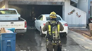 One taken to hospital, two displaced from Henderson home after garage fire