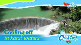Xiaoqikong visitors cool off among emerald mountains and jade streams