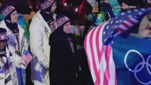 Maine Olympian proudly waves USA flag in Cortina, Italy