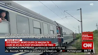 Two men died after their car was struck by a train
