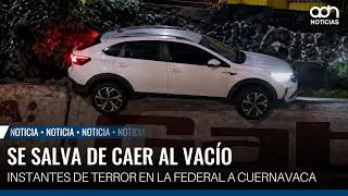 Car teeters on the edge of a cliff on the Federal Highway to Cuernavaca