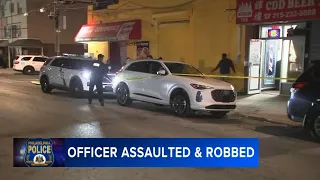 Off-duty officer beaten and robbed; police search for stolen firearm