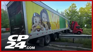 Driver charged after truck becomes stuck on road in Caledon