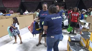 Las Vegas police, volunteers stuff 15,000 backpacks for Las Vegas students