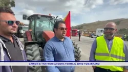 TRUCKS AND TRACTORS STILL STOPPED AT THE TUMARRANO JUNCTION
