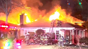 Large fire rips through home in north suburbs, officials say