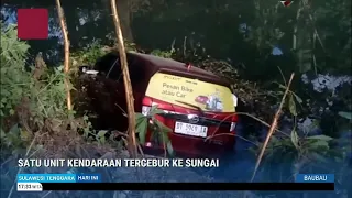 VEHICLE PLUNGES INTO RIVER