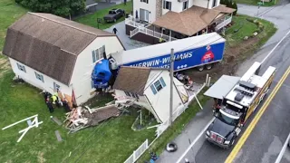 Residents renew calls for intersection safety after vehicle hits garages