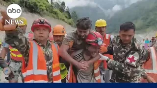 2 men found alive after being trapped for over a week by Nepal floods