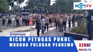 CHAOS AS OFFICERS PUSH BACK DOZENS OF PROTESTERS