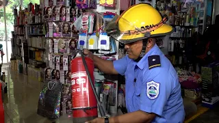 United Firefighters inspect the electrical system at Roberto Huembes Market