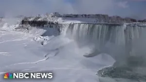Partially frozen Niagara Falls attracts tourists in below freezing temperatures