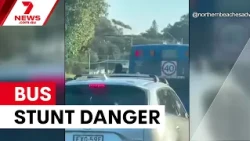 Teen filmed dangling from bus on Northern Beaches | 7NEWS