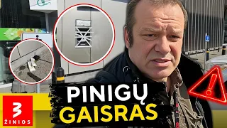 Pinigų nusiimti nespėjo: bankomatas užsidegė