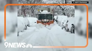 New York City Sanitation snowplow clears snow-covered road