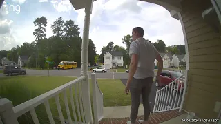 Ring camera captured an SUV driving past a stopped school bus
