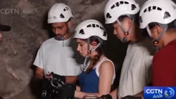 Tourists experience via ferrata in a Zhejiang province cave
