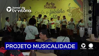 Children and teenagers bring music to the stage at a craft fair in Vitória