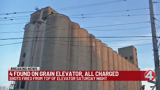 4 charged for climbing up, staying on grain elevator for 8 hours