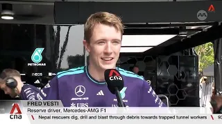Mercedes reserve driver Fred Vesti races down Orchard Road as part of motorsport festival