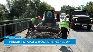 REPAIRING THE OLD BRIDGE OVER THE CHAGAN RIVER