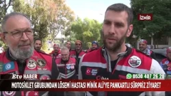 Motorcycle group pays surprise visit to little Ali, who has leukemia, with banners.