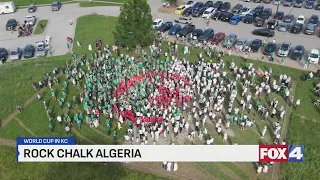 Residents, visitors join together to create Algerian flag ahead of World Cup match