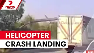 Russian military helicopter crashes after running out of fuel | 7NEWS