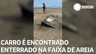 Car buried in beach sand found