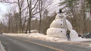 Shirley man builds 20-foot snowman for daughter