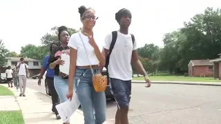 School leaders go door-to-door for registration