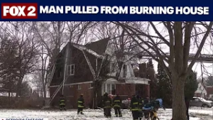 Man pulled from burning house in Detroit