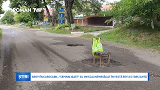 Gropi în carosabil, "semnalizate" cu un scaun îmbrăcat în vestă reflectorizantă
