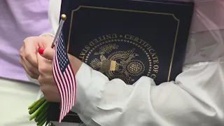 Nearly 100 people become U.S. citizens at Dirksen Federal Building