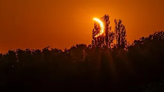 Hikers in awe as solar eclipse turns sky red over French Pyrenees