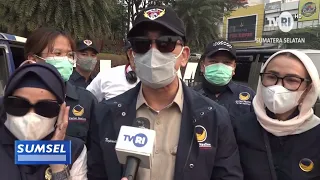 SOUTH SUMATRA TODAY - IMPACT OF HAZE FROM FOREST FIRES, NASDEM SUMSEL DISTRIBUTES MASKS TO DRIVERS