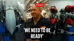 'Fully restocked': Sky News watches missiles unloaded aboard US aircraft carrier