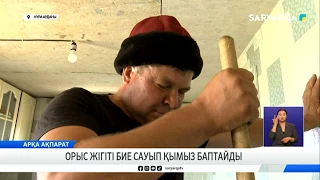 Russian guy milks a mare and prepares kumis
