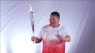 Former sumo champ completes torch relay in Nagoya ahead of Asian Games opening