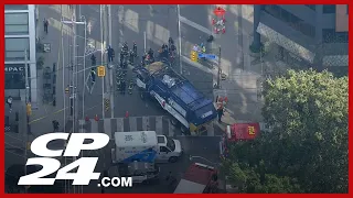 Pedestrian pinned by garbage truck in Toronto’s downtown core