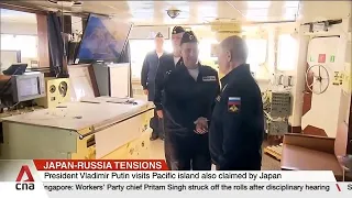 Japan summons Russian ambassador after Putin visits disputed islands for first time